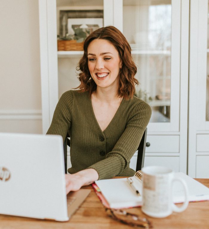 Female entrepreneur working on laptop Female entrepreneur working on laptop