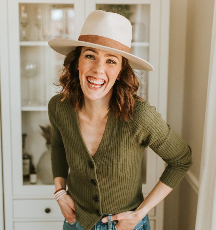 Woman wearing a hat and laughing